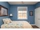 Cozy bedroom features hardwood floors, and a sunny window at 18357 Piers End Dr, Noblesville, IN 46062