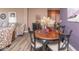 Cozy dining room area featuring wood flooring and a round table with seating for four at 18357 Piers End Dr, Noblesville, IN 46062