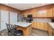 Cozy kitchen features wood cabinets, stainless steel appliances and a functional center island with seating at 18357 Piers End Dr, Noblesville, IN 46062