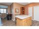 Open-concept kitchen featuring an island with seating, wood floors, and adjacent living area at 18357 Piers End Dr, Noblesville, IN 46062