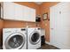 The laundry room features side by side washer and dryer machines with white storage cabinets above at 18357 Piers End Dr, Noblesville, IN 46062