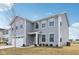 Charming two-story home with gray siding, a two-car garage, and manicured front yard at 1854 Cascades Dr, Greenfield, IN 46140