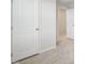 Hallway and closet details with white doors and neutral carpet at 1854 Cascades Dr, Greenfield, IN 46140