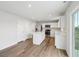 Bright, open kitchen with stainless steel appliances, center island, and wood floors at 1854 Cascades Dr, Greenfield, IN 46140