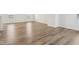 Spacious living room features sleek hardwood floors and plenty of natural light at 1854 Cascades Dr, Greenfield, IN 46140