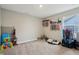 Room with gray walls, neutral carpet, trophies, medals, and clothing rack for hobbies and storage at 1945 Clement St, Westfield, IN 46074