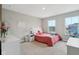 Bedroom with two large windows, neutral walls, and a pink quilt with white furniture at 1945 Clement St, Westfield, IN 46074