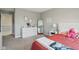 Bedroom featuring white furniture, pink and white quilt, and a full-length mirror at 1945 Clement St, Westfield, IN 46074