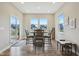 Bright breakfast nook featuring natural light, wood floors, and backyard views at 1945 Clement St, Westfield, IN 46074