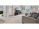 Living room featuring a sectional sofa, TV, and neutral carpet at 1945 Clement St, Westfield, IN 46074