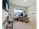 Home office with a large window, wood desk, and neutral carpet at 1945 Clement St, Westfield, IN 46074