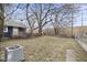 Spacious backyard with a well-maintained lawn and central air conditioning unit at 2040 Laurel St, Indianapolis, IN 46203