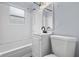Updated bathroom with modern sink, toilet, and subway tile at 2040 Laurel St, Indianapolis, IN 46203