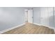 Bedroom featuring fresh paint, wood-look floors, and two doors at 2040 Laurel St, Indianapolis, IN 46203