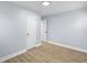 A clean bedroom with modern wood-look floors and fresh paint at 2040 Laurel St, Indianapolis, IN 46203