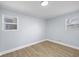 This cozy bedroom features durable floors, neutral-toned walls, and natural light from the window at 2040 Laurel St, Indianapolis, IN 46203