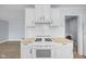A well-lit kitchen showcases modern appliances, ample cabinetry, and an adjoining laundry area at 2040 Laurel St, Indianapolis, IN 46203