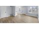 Inviting living area with durable floors, neutral paint, and a view of the home's entrance at 2040 Laurel St, Indianapolis, IN 46203