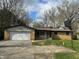 Charming single-story brick home featuring an attached garage and basketball hoop on a sunny day at 2346 Mayfair Dr, Indianapolis, IN 46260