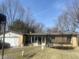 Charming single-story home with a brick facade and attached garage on a sunny day at 2346 Mayfair Dr, Indianapolis, IN 46260
