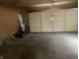Attached garage offering ample space for parking and storage at 2346 Mayfair Dr, Indianapolis, IN 46260
