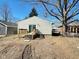 Backyard showing a partial view of the house, deck, and fence at 2523 S Mcclure St, Indianapolis, IN 46241