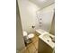 Functional bathroom with a shower-tub combo, tiled floors, toilet and vanity at 2523 S Mcclure St, Indianapolis, IN 46241