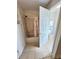 Bathroom featuring a tub and shower with neutral tile flooring and a nearby toilet at 2523 S Mcclure St, Indianapolis, IN 46241