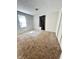 Comfortable bedroom with plush carpeting, a window, and a closet at 2523 S Mcclure St, Indianapolis, IN 46241