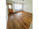 Inviting living room with polished hardwood floors and a decorative chandelier at 2523 S Mcclure St, Indianapolis, IN 46241