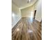 Bright living room featuring wood laminate floors, light walls, and a vaulted ceiling at 2523 S Mcclure St, Indianapolis, IN 46241