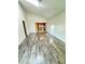 Bright living room with wood-look floors leads into kitchen, with an open concept design at 2523 S Mcclure St, Indianapolis, IN 46241