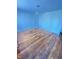 Spacious living room featuring hardwood floors and neutral-colored walls at 2523 S Mcclure St, Indianapolis, IN 46241