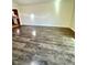 Open living area features wood-look flooring and ample space for versatile furnishing options at 2523 S Mcclure St, Indianapolis, IN 46241