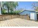 Backyard with a wooden deck perfect for entertaining, with partial views of the home and mature trees at 2528 Guilford Ave, Indianapolis, IN 46205