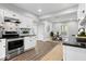 Bright kitchen with modern stainless steel appliances, white cabinets, and stylish backsplash at 2528 Guilford Ave, Indianapolis, IN 46205