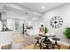 Bright, open kitchen with white cabinets, stainless steel appliances, and a cozy dining nook with decorative clock at 2528 Guilford Ave, Indianapolis, IN 46205
