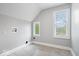 Bright laundry room features tile flooring, connections for a washer and dryer, and natural light from a window at 2528 Guilford Ave, Indianapolis, IN 46205
