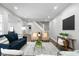 Comfortable living room featuring stylish furniture, sleek flooring, and modern decorations at 2528 Guilford Ave, Indianapolis, IN 46205