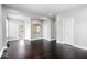 Spacious living room featuring hardwood floors, neutral walls, and closet space at 2528 Guilford Ave, Indianapolis, IN 46205