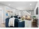 Bright and open living space with stylish seating, staircase, and view of the dining area at 2528 Guilford Ave, Indianapolis, IN 46205