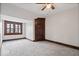Bedroom showcasing natural light from the window, neutral paint, and carpeting at 2532 Madison Ave, Indianapolis, IN 46225