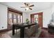 Elegant dining room featuring wood floors, trim, and a modern table set, great for entertaining at 2532 Madison Ave, Indianapolis, IN 46225