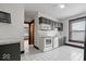This kitchen features gray cabinets, tile flooring, and stainless steel appliances at 2532 Madison Ave, Indianapolis, IN 46225
