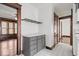 This kitchen includes a counter, gray cabinets, and hardwood floor in the adjacent room at 2532 Madison Ave, Indianapolis, IN 46225