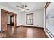 Living room with hardwood floors, ceiling fan, and wood trim offers a warm and inviting ambiance at 2532 Madison Ave, Indianapolis, IN 46225