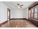 Spacious living room with hardwood floors, bright walls, and large window, providing comfort and style at 2532 Madison Ave, Indianapolis, IN 46225