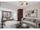 Bright living room showcasing modern furniture, artwork, and natural light from the large window at 2532 Madison Ave, Indianapolis, IN 46225