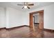 Open living area featuring classic hardwood floors, neutral walls, and a doorway to the adjacent room at 2532 Madison Ave, Indianapolis, IN 46225