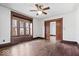 Sunlit living room with hardwood floors, a large window, and classic wood trim, offering warmth and charm at 2532 Madison Ave, Indianapolis, IN 46225